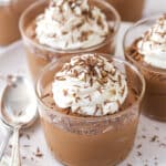 Chocolate mousse cups topped with whipped cream