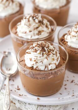 Chocolate mousse cups topped with whipped cream