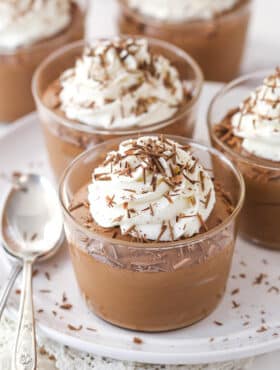 Chocolate mousse cups topped with whipped cream