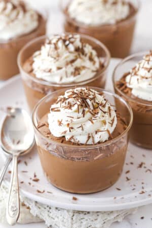 Chocolate mousse cups topped with whipped cream