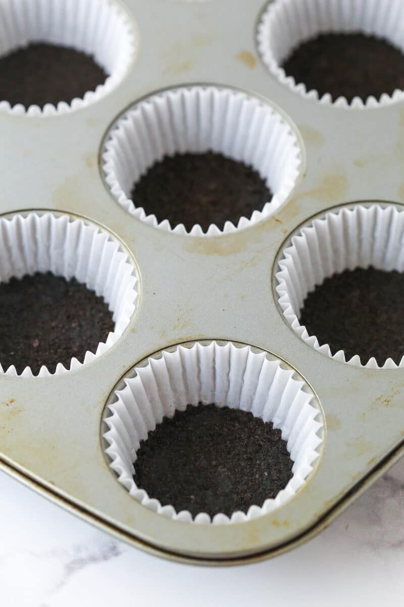 crusts pressed into cupcake pan with liners