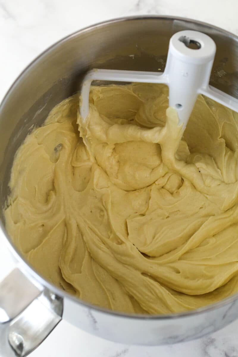 Adding eggs and vanilla to cake batter