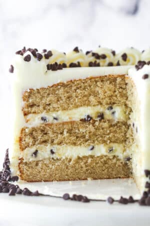 Cannoli layer cake with a slice missing