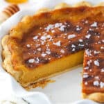 Salted honey pie with a slice missing