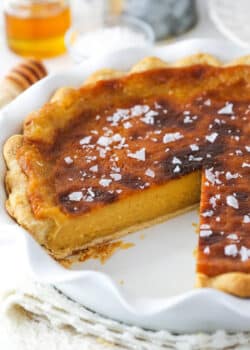 Salted honey pie with a slice missing