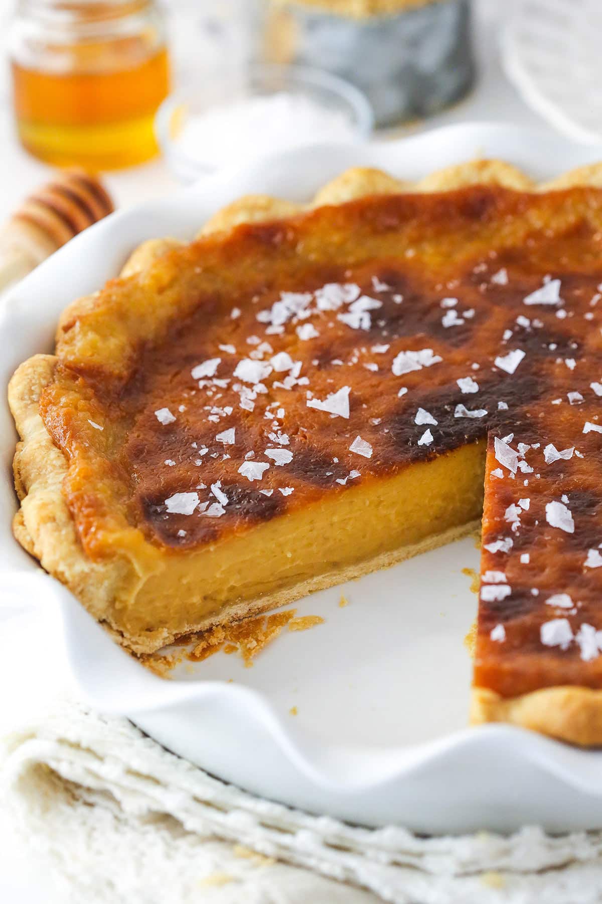 Salted honey pie with a slice missing