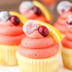 close up image of Cranberry Mimosa Cupcakes on cake stand