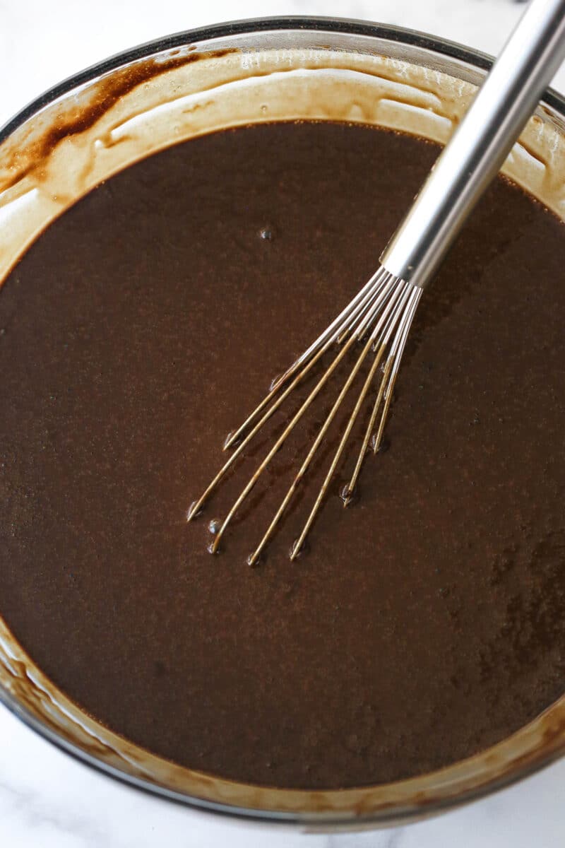 wet and dry ingredients combined in a glass bowl