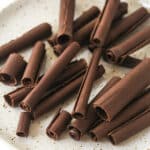 chocolate curls on a speckled plate