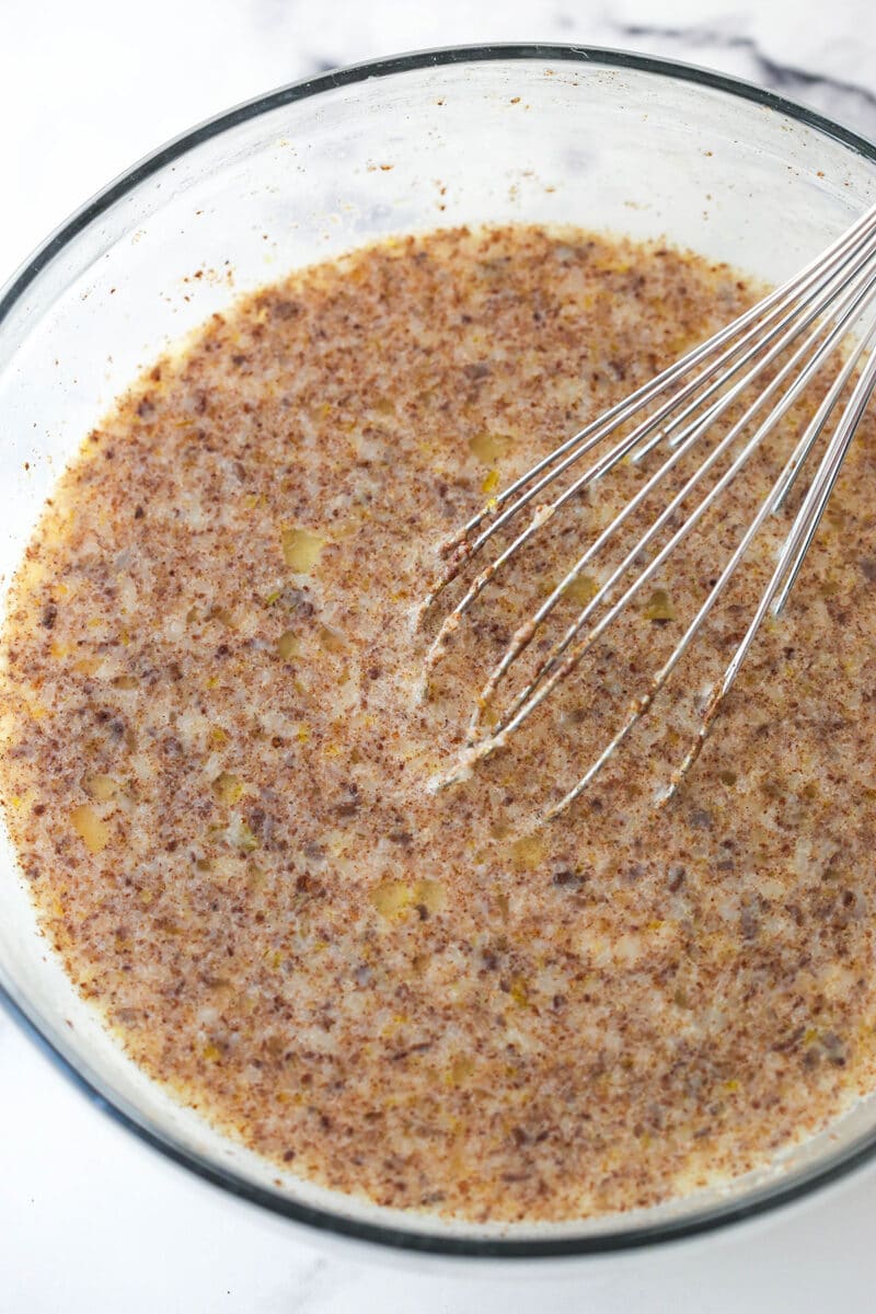 Mixing custard for bread pudding in a bowl.