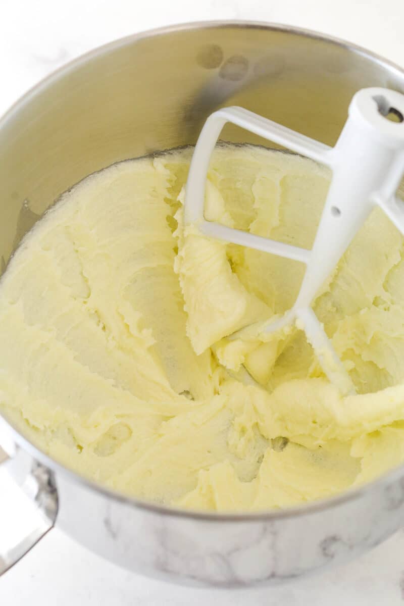 Creaming butter and sugar together in a mixing bowl.