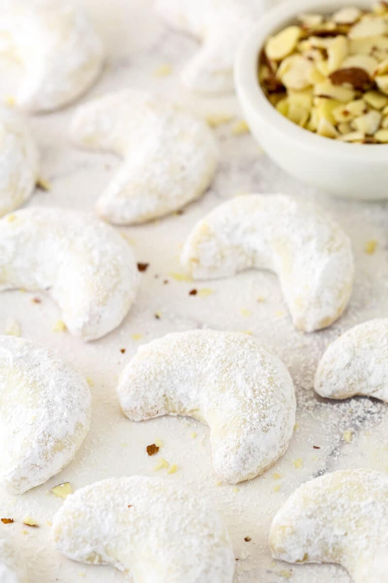 Powdered sugar-dusted almond crescents.