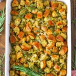 Overhead view of Classic Homemade Stuffing in a white serving platter on a wooden table