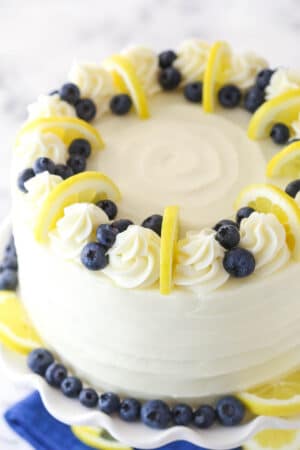 Tray of refreshing summer cakes featuring berry icebox cake, lemon summer cake, and strawberry summer cake with vibrant fruit toppings.