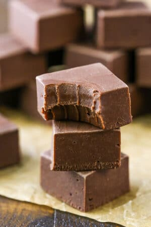 A stack of 3 pieces of chocolate fudge