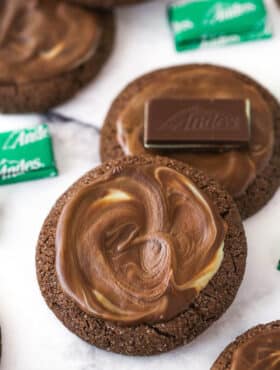 Overhead image of Andes mint cookies. One has an Andes mint on top of it.