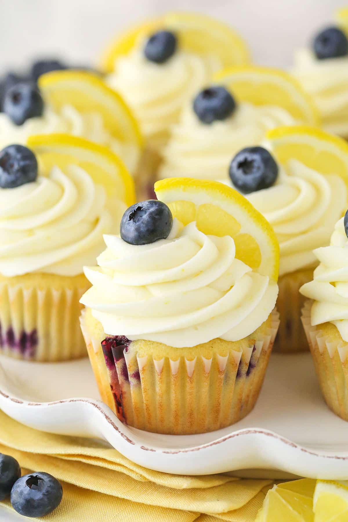Closeup image of lemon blueberry cupcakes on a serving platter.