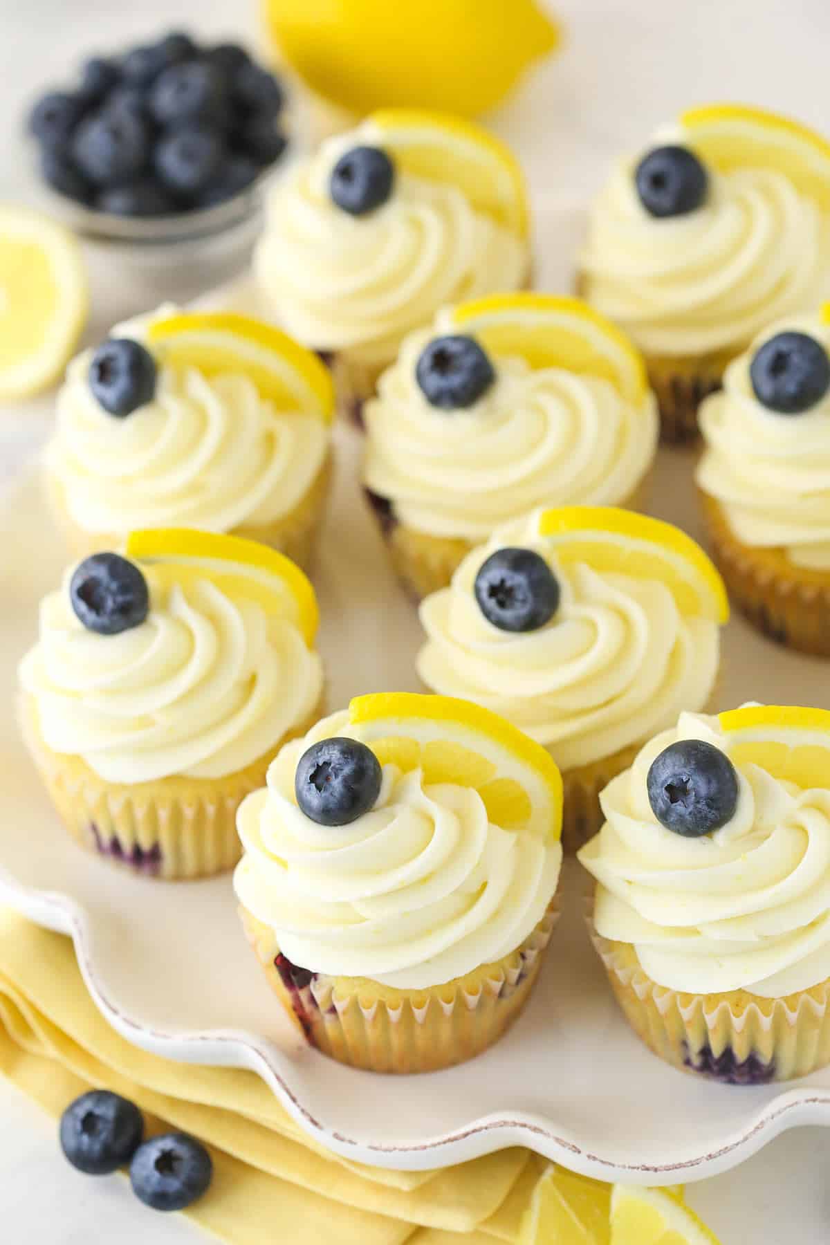 Overhead image of lemon blueberry cupcakes on a serving platter.