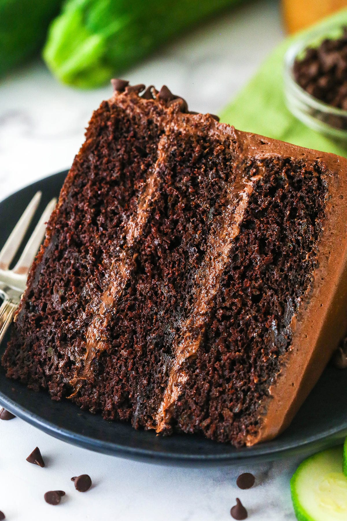 A slice of chocolate zucchini cake on a plate.