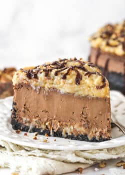 A slice of German chocolate cheesecake on a plate.