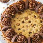 Reese's peanut butter cookie cake on a serving plate.