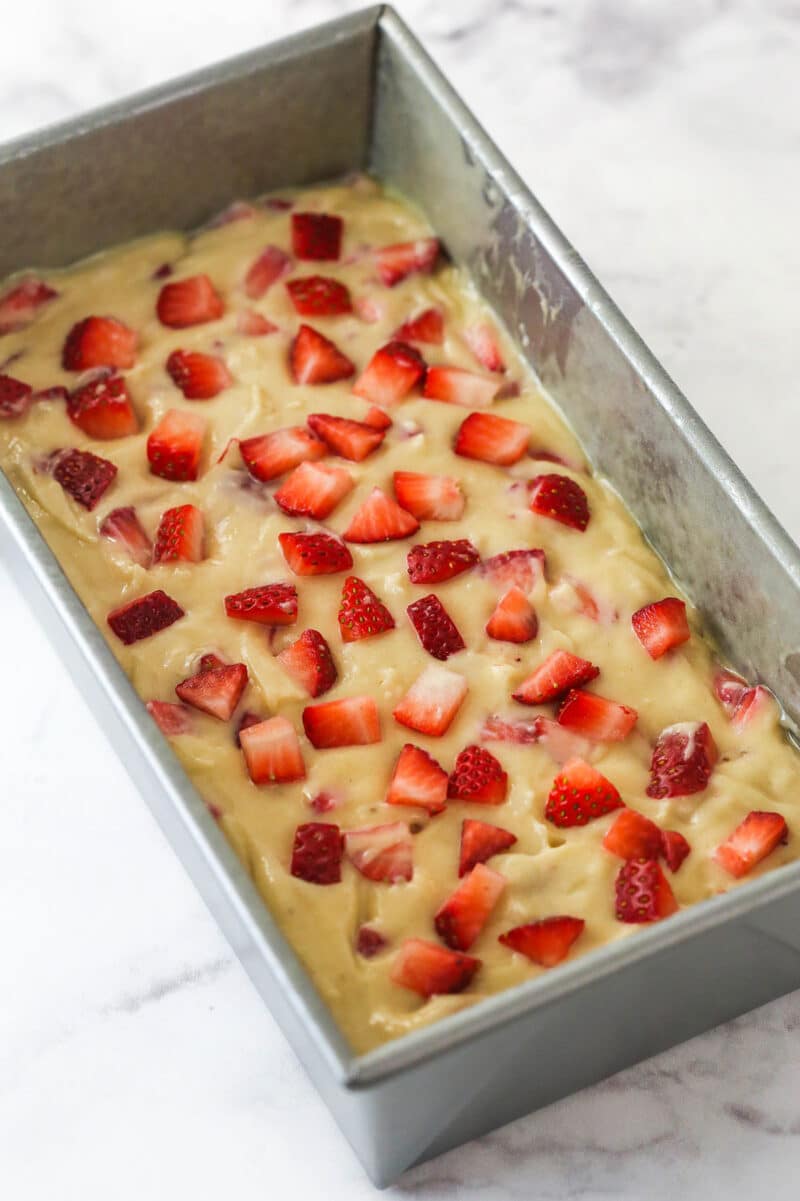 Strawberry bread batter in a loaf pan.