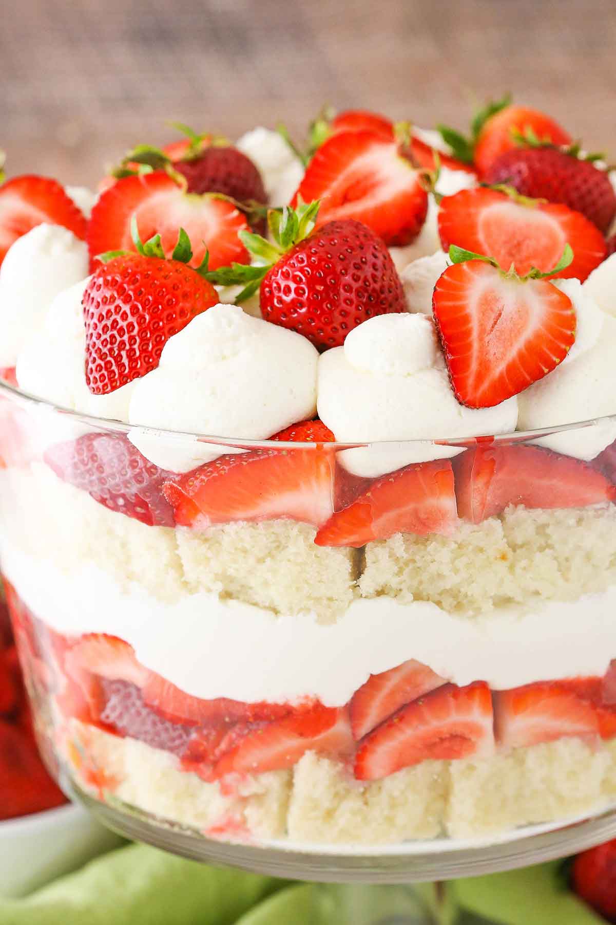 Side view of a full Strawberry Shortcake Trifle in a glass trifle dish
