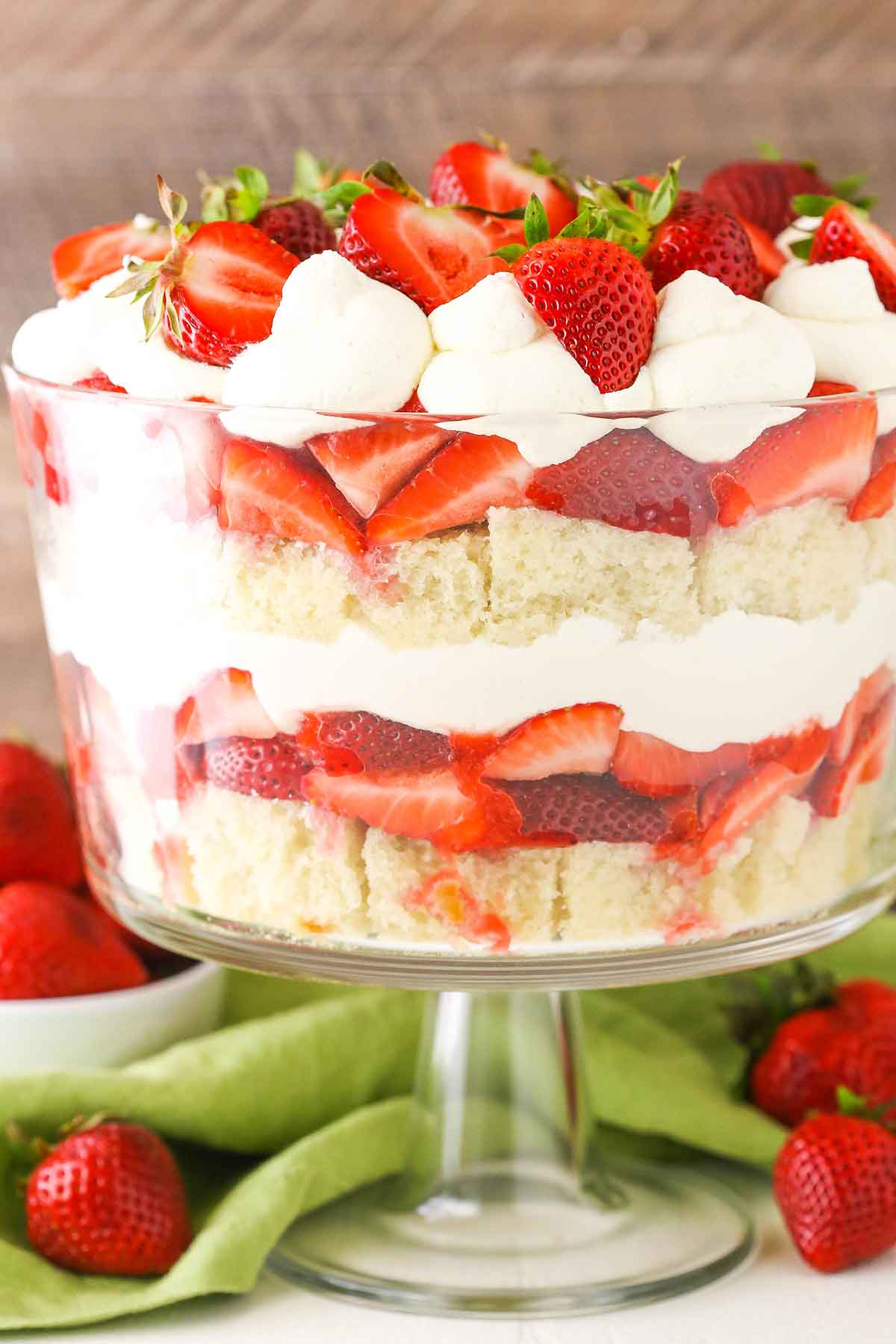 Side view of a full Strawberry Shortcake Trifle in a glass trifle dish