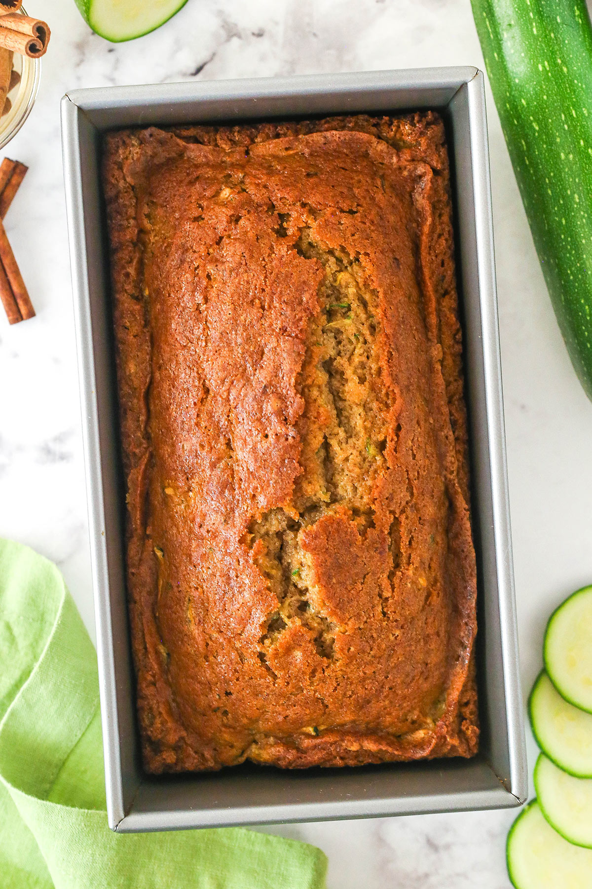 Overhead image of zucchini bread in a loaf pan.