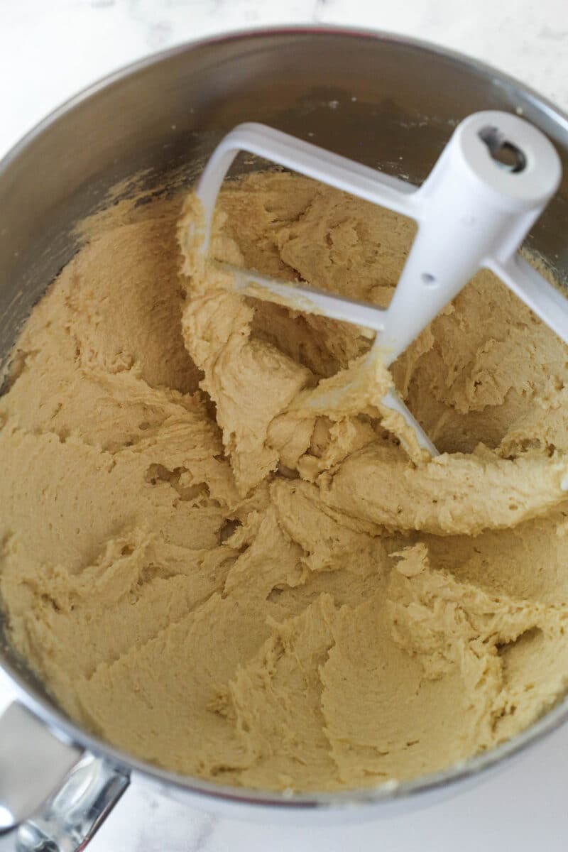 In a mixing bowl, cream ingredients for Apple Cinnamon Oatmeal Cookie Dough.