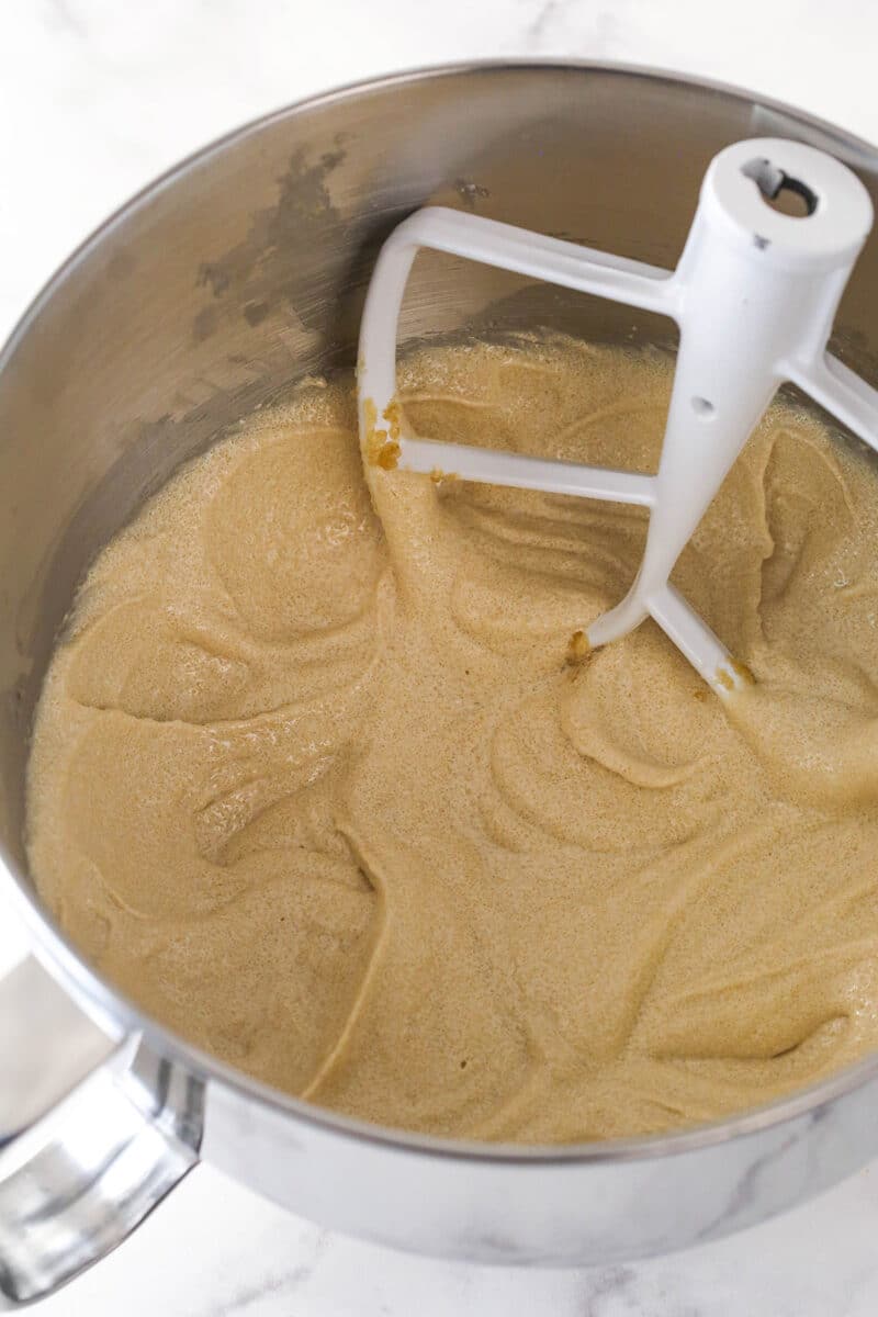 A mixing bowl with creamed cake batter ingredients.