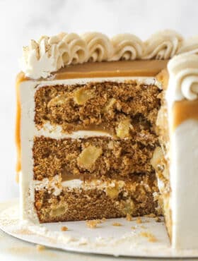 Side view of a Caramel Apple Layer Cake with slices removed to show interior layers.