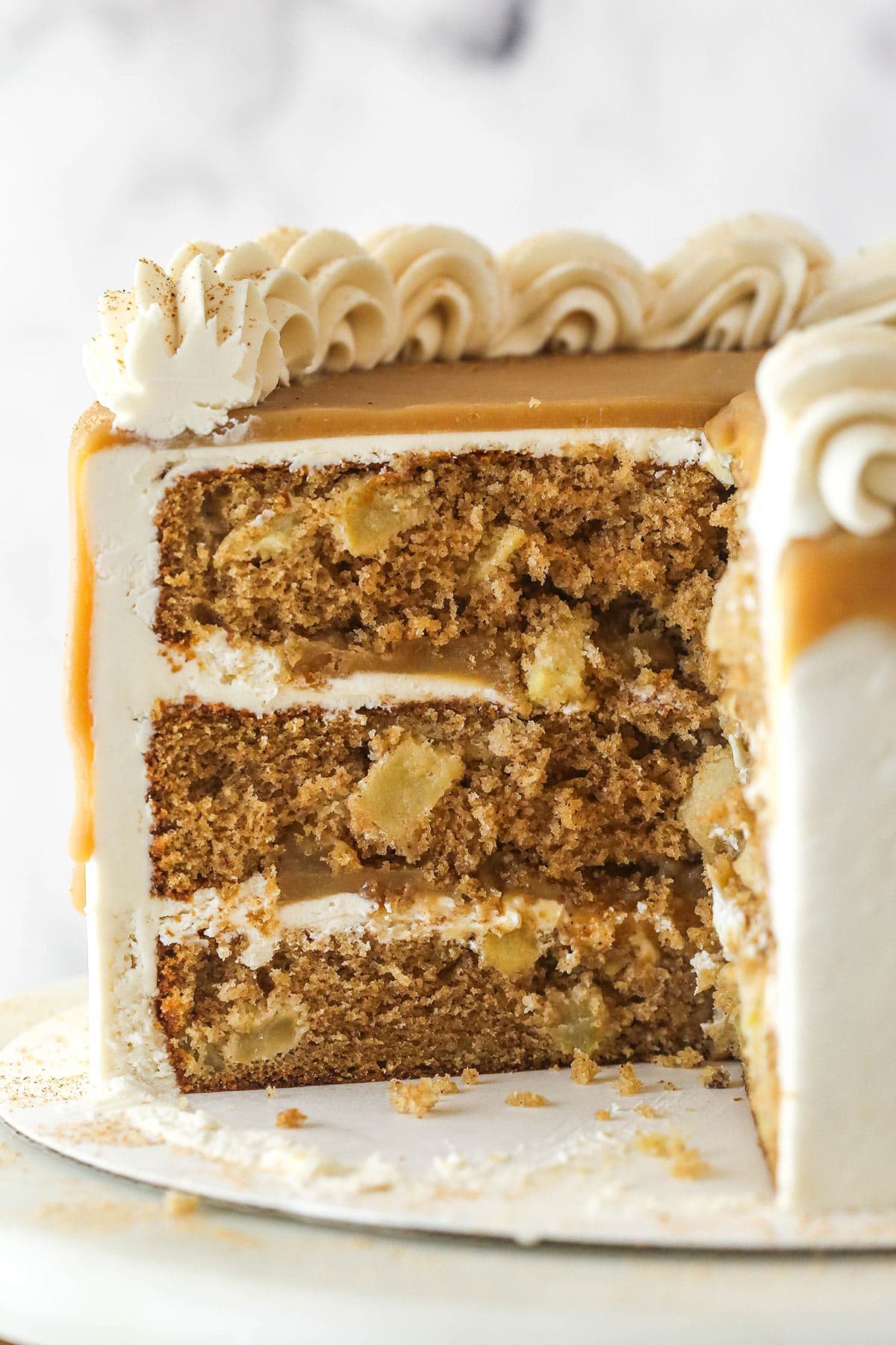 Side view of a Caramel Apple Layer Cake with slices removed to show interior layers.