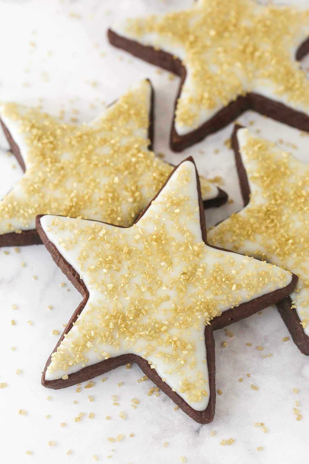 Chocolate cut out star cookies decorated with icing