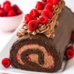 Raspberry chocolate swiss roll topped with raspberires