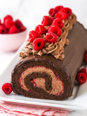 Raspberry chocolate swiss roll topped with raspberires