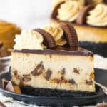 A slice of Reese's cheesecake on a plate