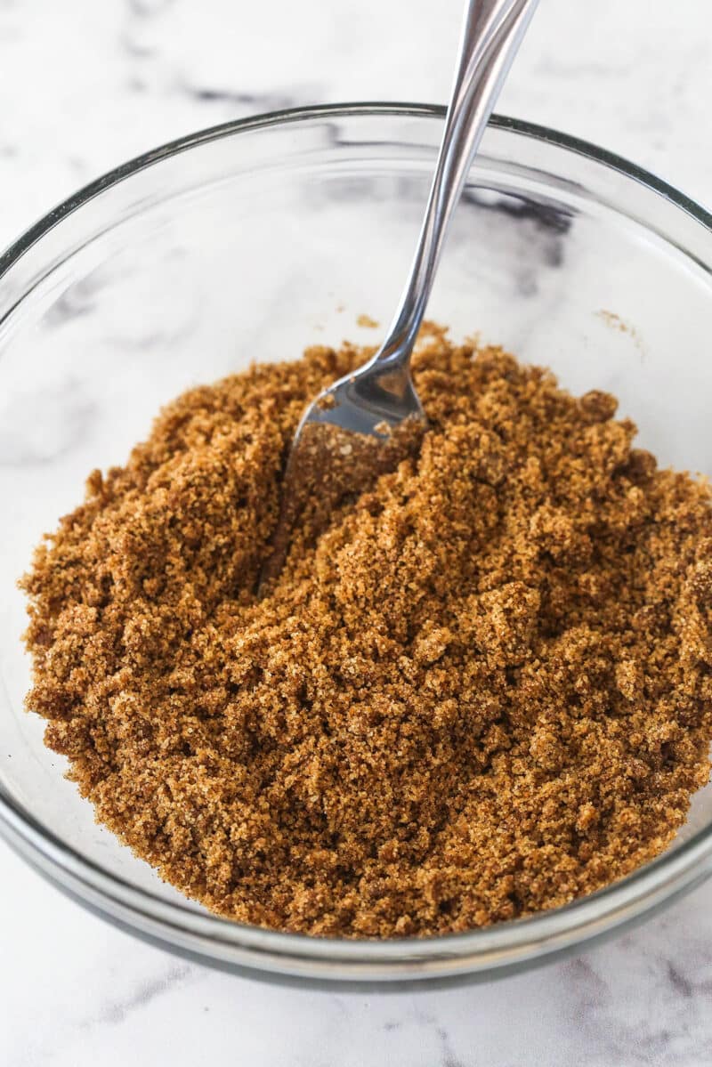 A clear glass bowl filled with cinnamon brown sugar filling.