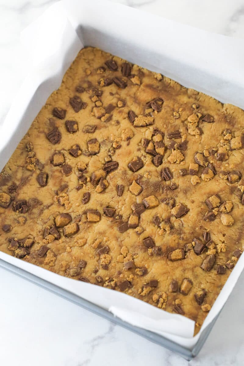 Chilled Reese's peanut butter cup fudge in a square pan