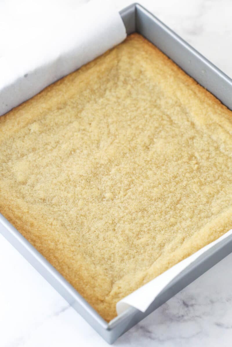 A pan of baked maple cookie bars in the pan.