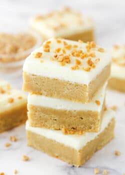 A stack of frosted maple cookie bars.