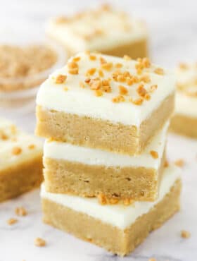 A stack of frosted maple cookie bars.