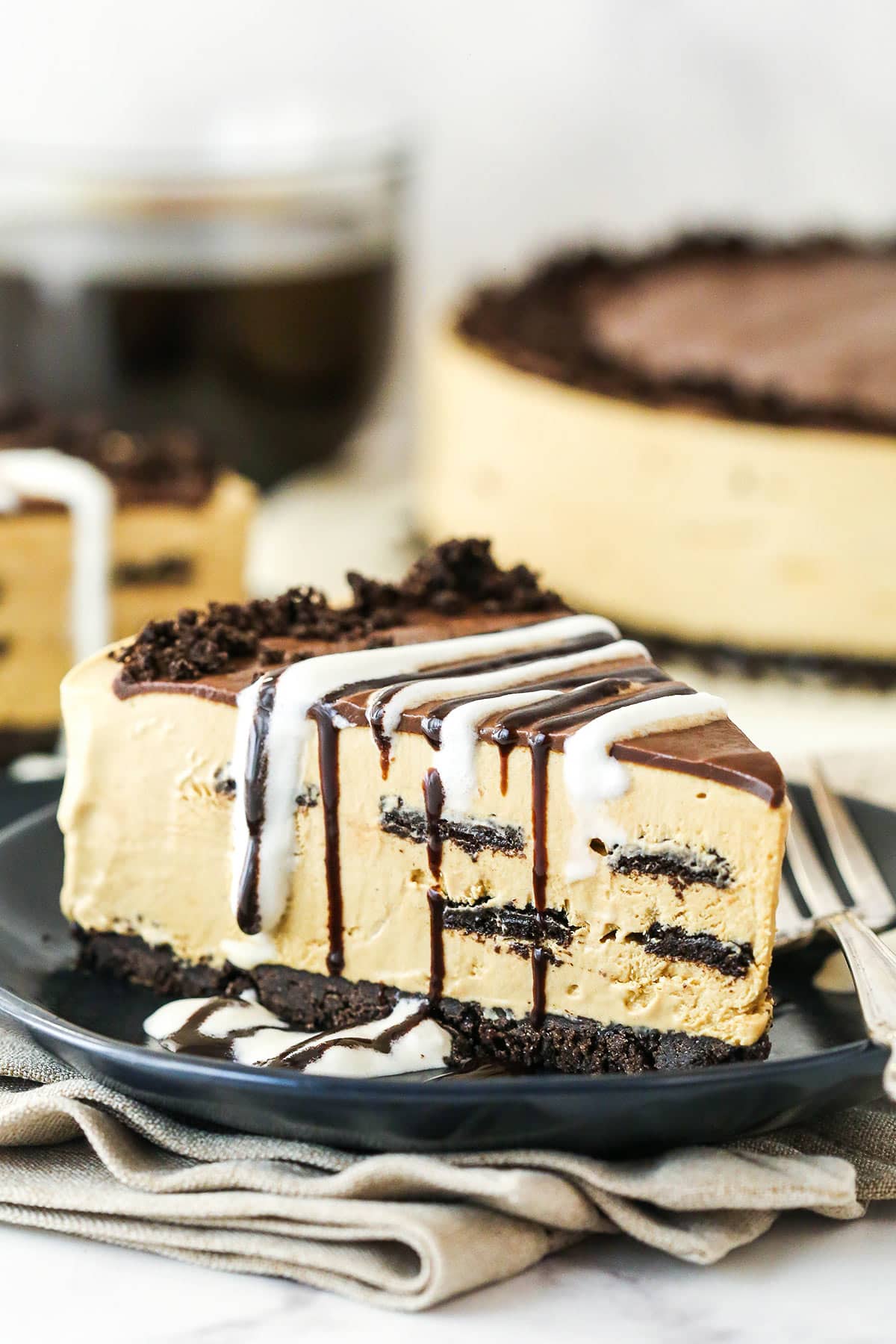 A slice of Kahlua Ice Cream Pie on a small black dessert plate.