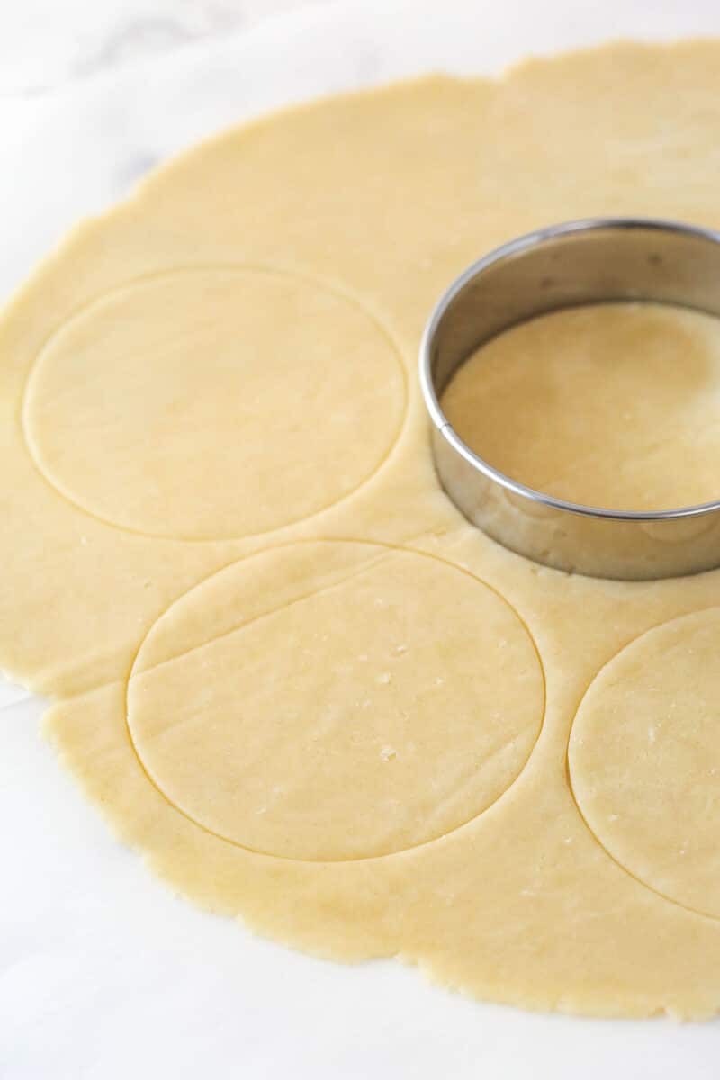 Cutting small circles out of pie crust with a cookie cutter