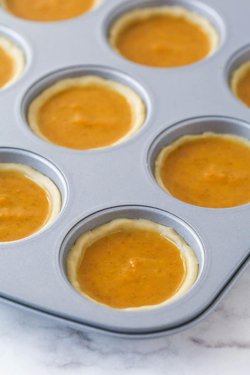 Unbaked mini pumpkin pies in a cupcake pan