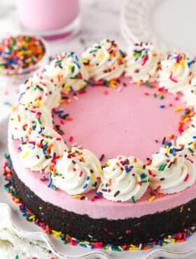 A fully decorated No Bake Strawberry Milkshake Cheesecake.