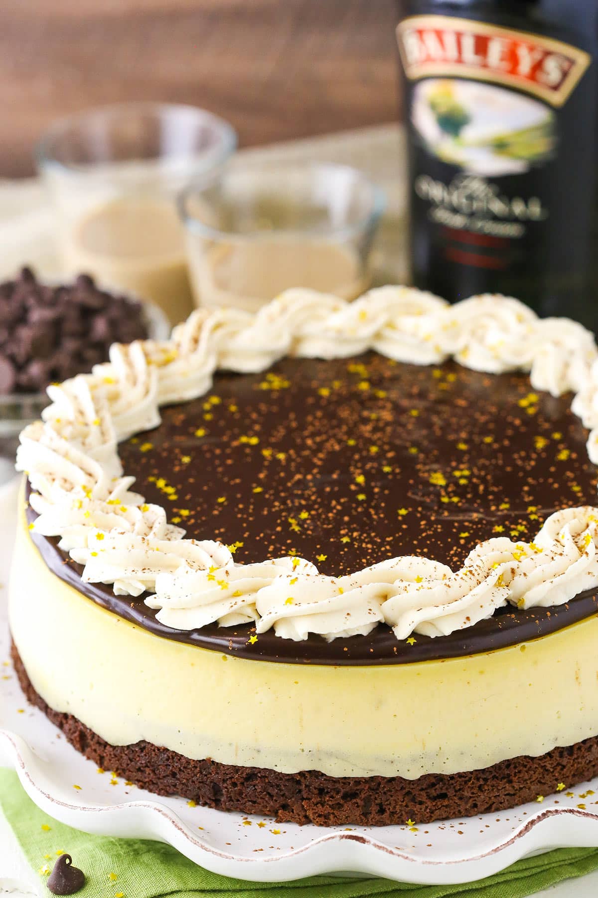 A full Baileys Brownie Cheesecake on a white platter