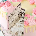 A slice of Carvel Cake being lifted on a cake server