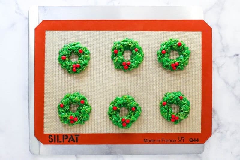 Cornflake wreath cookies on a baking sheet