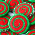 A pile of Christmas pinwheel cookies on a plate